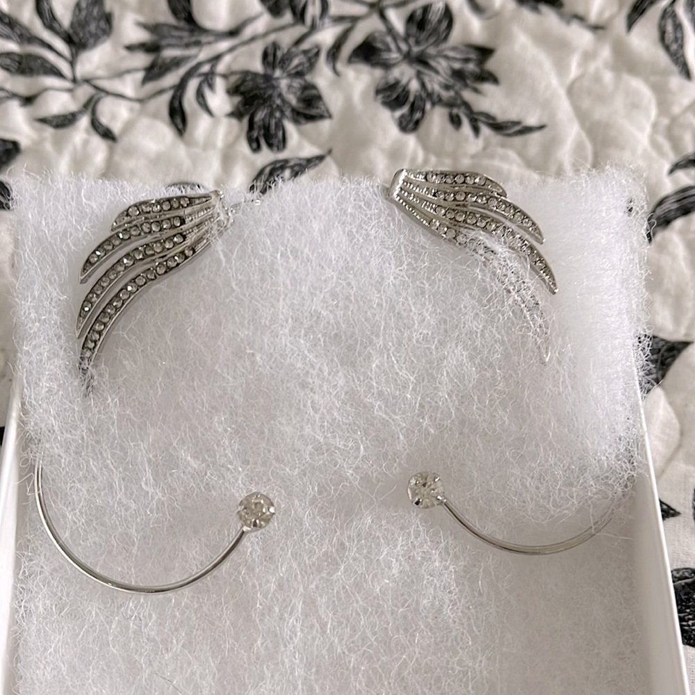 Silver earrings that slip around your ears